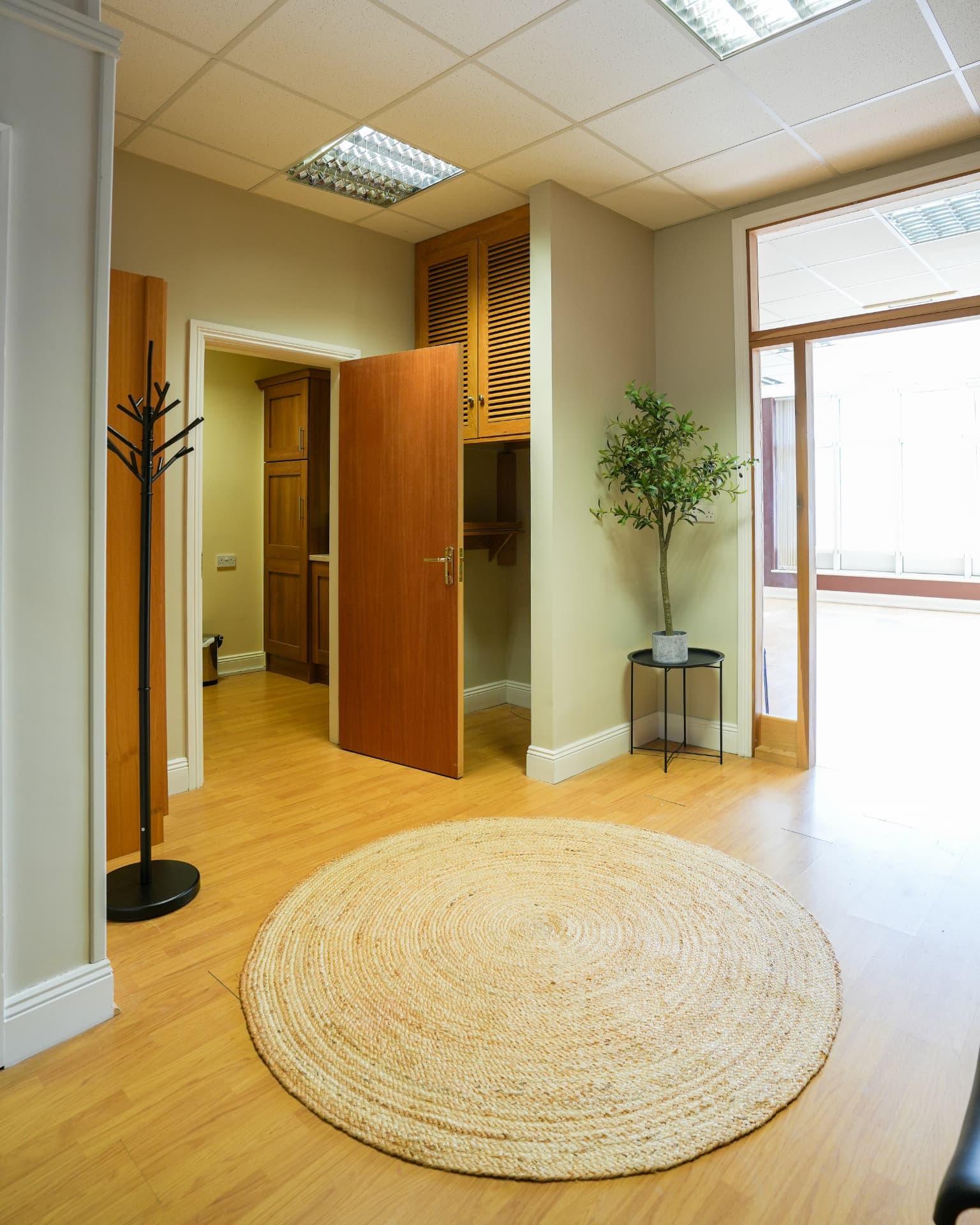The studio entrance and waiting area with kitchenette beyond